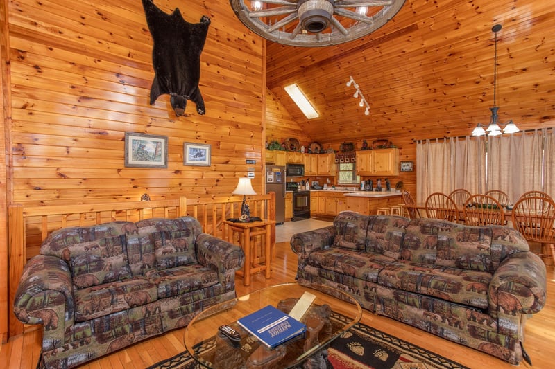 Couch and loveseat in the living room at Bear Country, a 3bedroom cabin rental located in Pigeon Forge