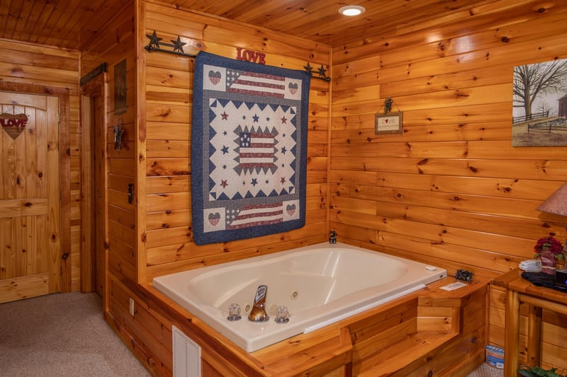 Jacuzzi in the king bedroom at Bear Country, a 3bedroom cabin rental located in Pigeon Forge