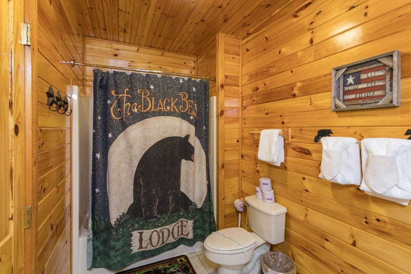 Bathroom with black bear decor at Bear Country, a 3bedroom cabin rental located in Pigeon Forge