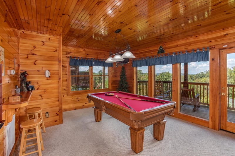 Red felted pool table at Bear Country, a 3bedroom cabin rental located in Pigeon Forge