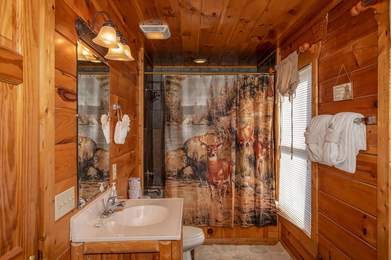 Bathroom with a tub and shower at 5 Star View, a 3 bedroom cabin rental located in Gatlinburg