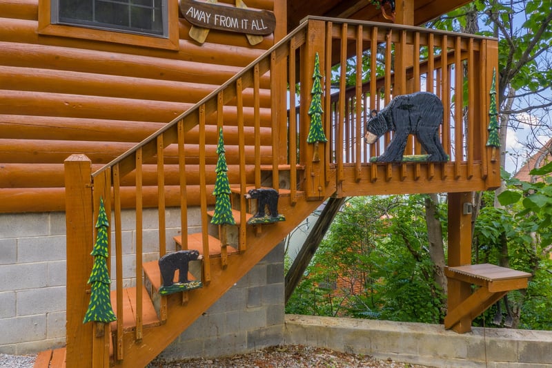 Custom woodwork on the stairs at Away From it All, a 1 bedroom cabin rental located in Pigeon Forge