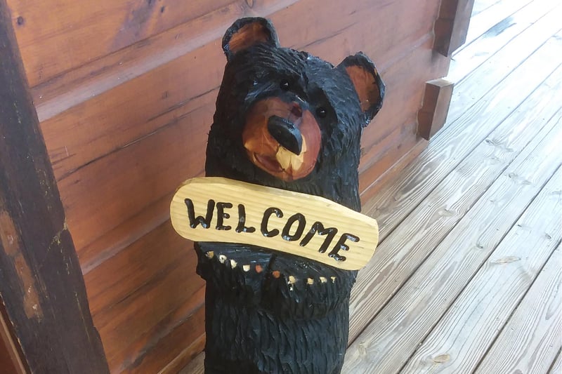 Bear welcome sign at Moonbeams  Cabin Dreams, a 3 bedroom cabin rental located in Pigeon Forge