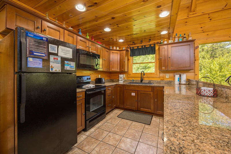 Kitchen at Moonbeams  Cabin Dreams, a 3 bedroom cabin rental located in Pigeon Forge