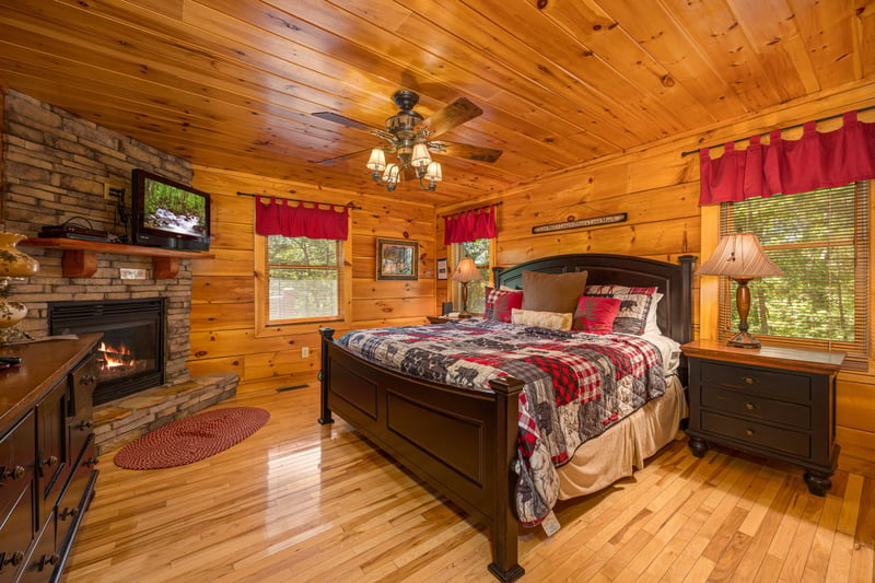 Fireplace in bedroom at Moonbeams  Cabin Dreams, a 3 bedroom cabin rental located in Pigeon Forge