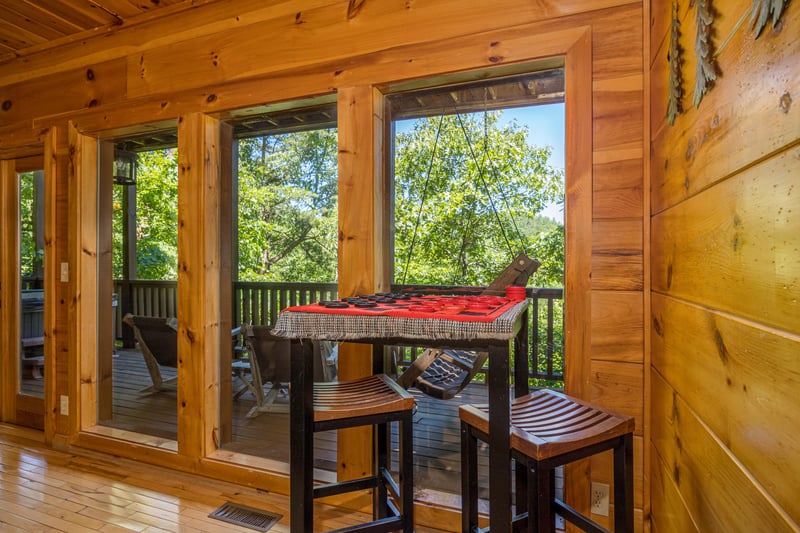 Checkers at Moonbeams  Cabin Dreams, a 3 bedroom cabin rental located in Pigeon Forge