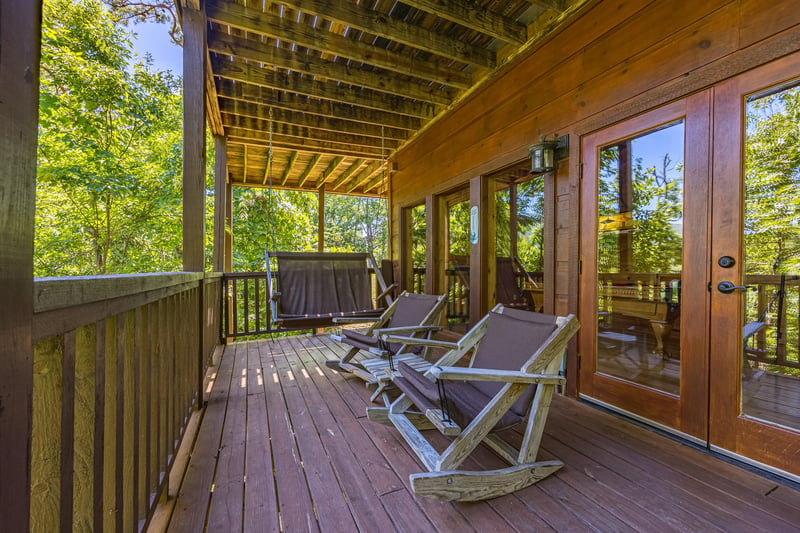 Adirondack rocking chairs at Moonbeams  Cabin Dreams, a 3 bedroom cabin rental located in Pigeon Forge