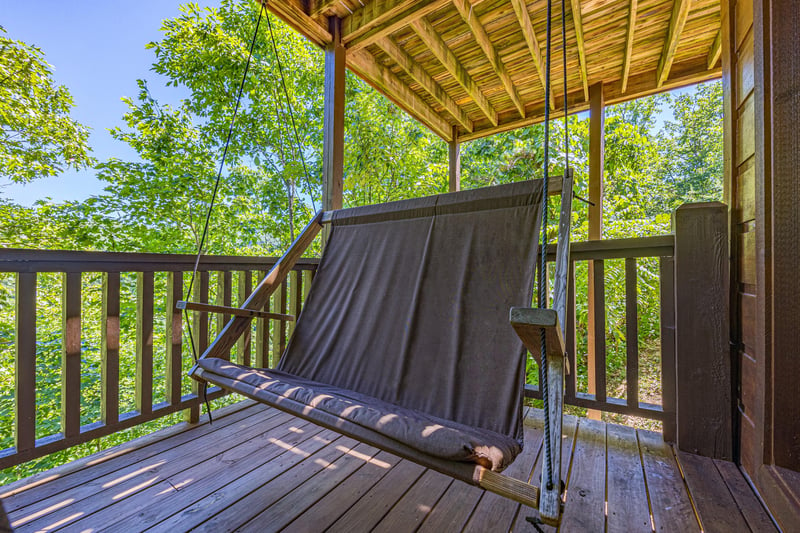 Cloth porch swing at Moonbeams  Cabin Dreams, a 3 bedroom cabin rental located in Pigeon Forge