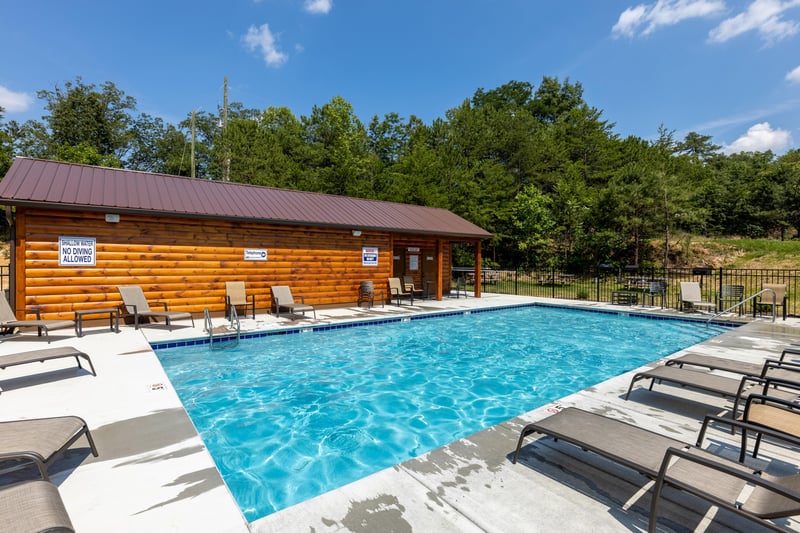 Resort pool for guests at Away From it All, a 1 bedroom cabin rental located in Pigeon Forge