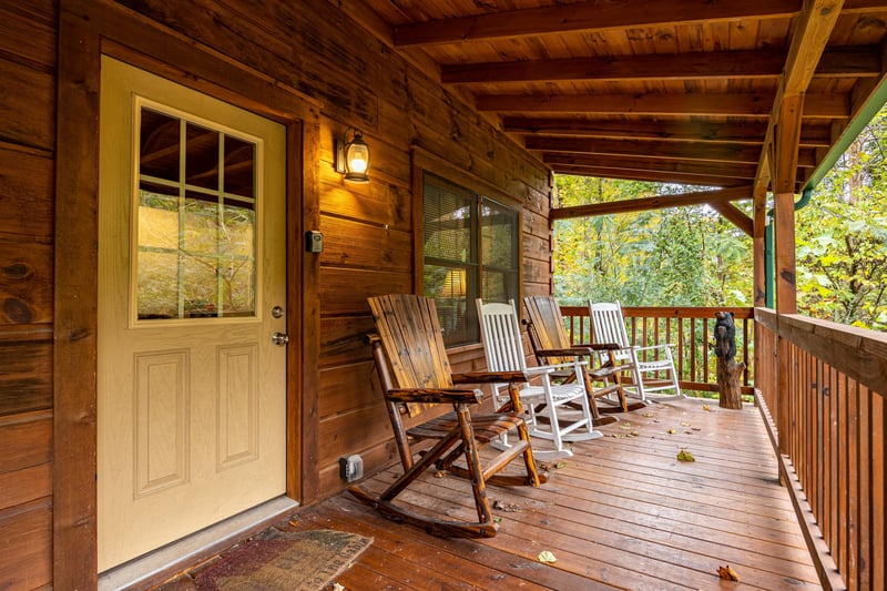 Front Door and Deck with Rockers at Tammys Place At Baskins Creek, a 2 bedroom cabin rental located in gatlinburg