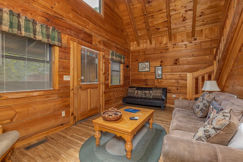 Seating in a living room at Walkin To Gatlinburg, a 2 bedroom cabin rental located in Gatlinburg