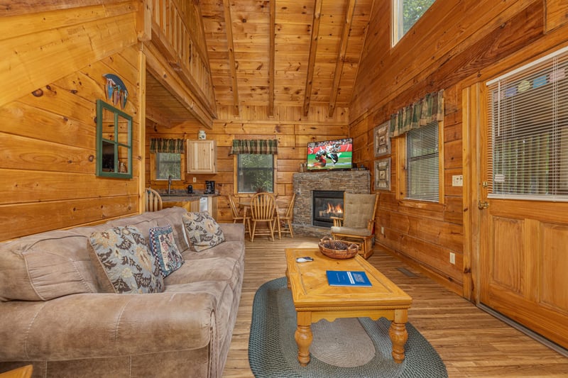 Living room with TV and fireplace at Walkin To Gatlinburg, a 2 bedroom cabin rental located in Gatlinburg