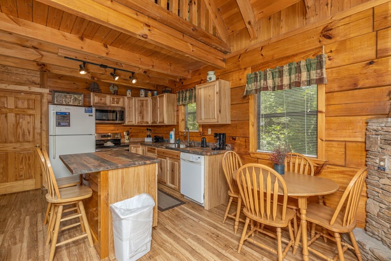 Kitchen and dining space at Walkin To Gatlinburg, a 2 bedroom cabin rental located in Gatlinburg