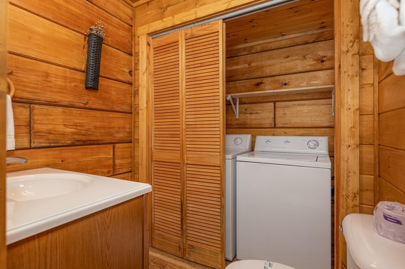 Washer and dryer in a bathroom at Walkin To Gatlinburg, a 2 bedroom cabin rental located in Gatlinburg