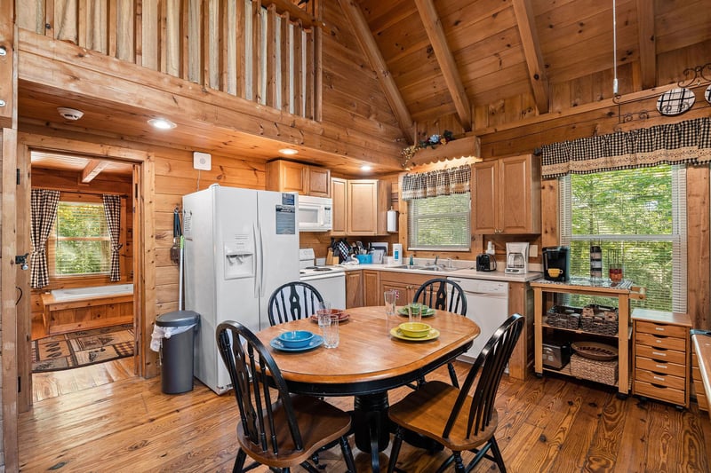 Dining room space with seating for four in the great room at Cloud 9, a 1bedroom cabin rental located in Pigeon Forge