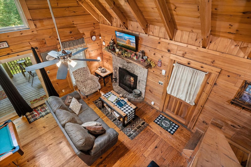 Living room from the loft at Cloud 9, a 1bedroom cabin rental located in Pigeon Forge