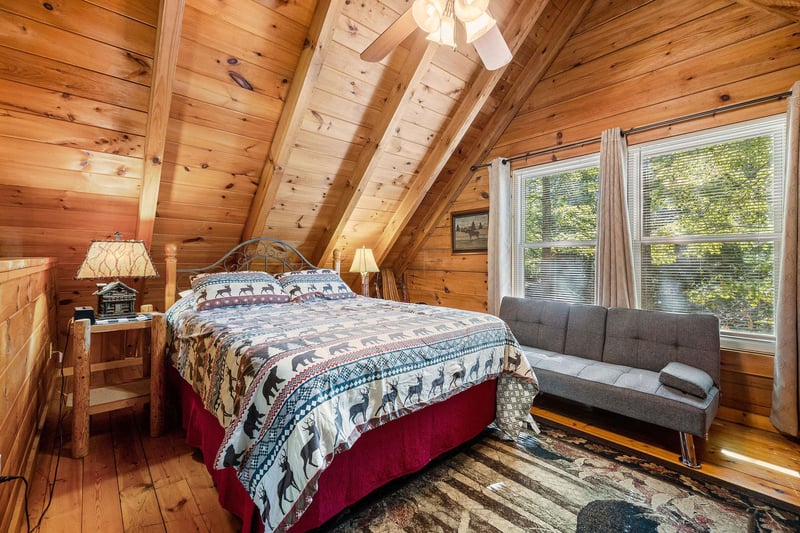 Queensized bed in the loft at Cloud 9, a 1bedroom cabin rental located in Pigeon Forge