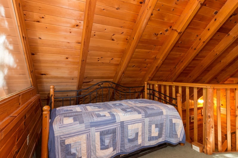 Twin bed in the loft at Hawks Nest, a 1 bedroom cabin rental located in Pigeon Forge