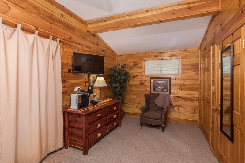 Dresser and TV in a bedroom at Birds Eye View, a 2bedroom cabin rental located in Gatlinburg