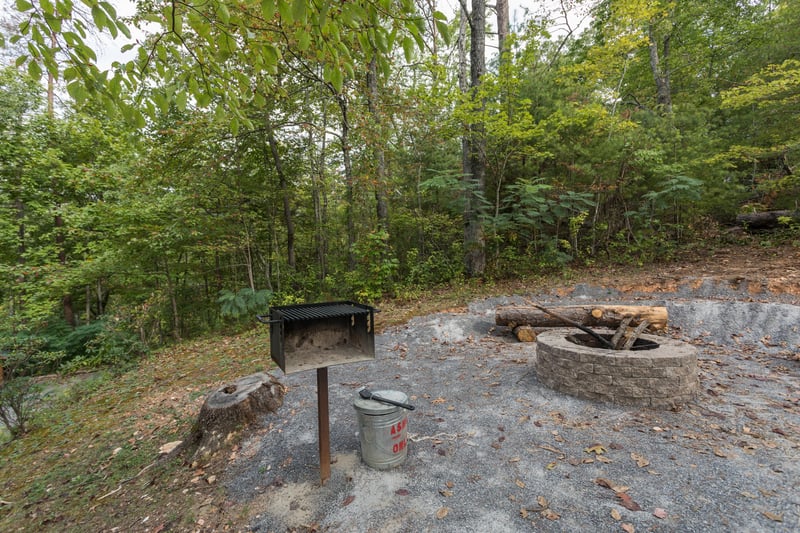 Grill and fire pit at Birds Eye View, a 2bedroom cabin rental located in Gatlinburg