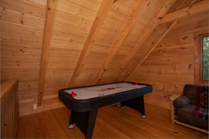 Air hockey table in the game loft at Cedar Creeks, a 2bedroom cabin rental located near Douglas Lake