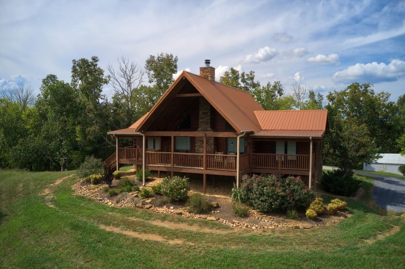 Looking at the front exterior of Cedar Creeks, a 2bedroom cabin rental located near Douglas Lake