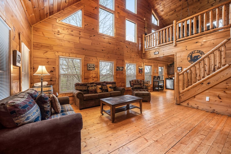 Sofa and chair in the living room at Moonshine Memories, a 2 bedroom cabin rental located in Gatlinburg