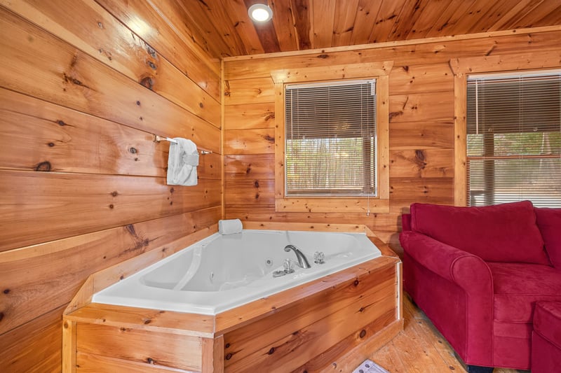 Jacuzzi in the corner of a bedroom at Moonshine Memories, a 2 bedroom cabin rental located in Gatlinburg