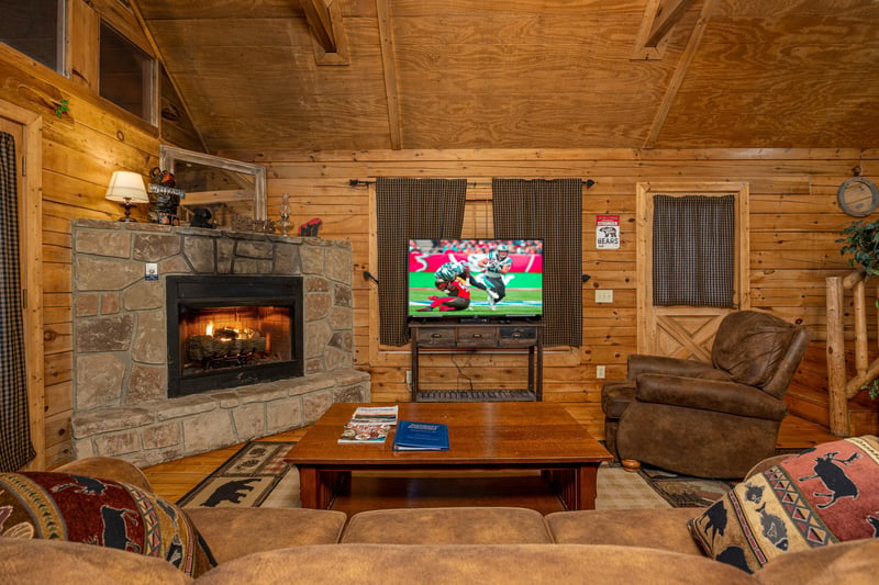 Livingroom fireplace at Lincoln Logs, a 2 bedroom cabin rental located in Gatlinburg