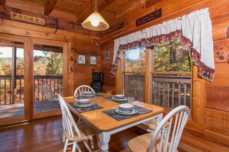 Dining table for four at Hawks Nest, a 1 bedroom cabin rental located in Pigeon Forge