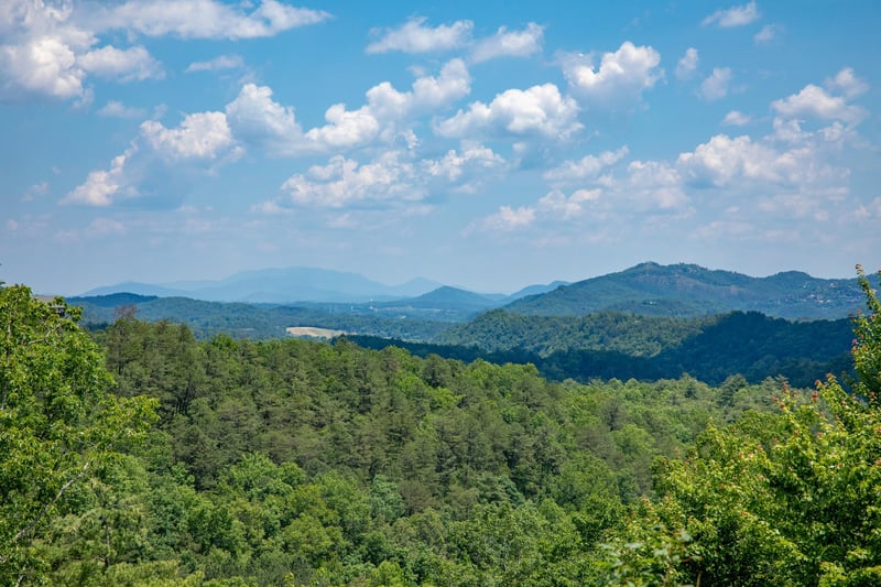 Looking out at the view from the deck at Gods Country, a 4 bedroom cabin rental located in Pigeon Forge