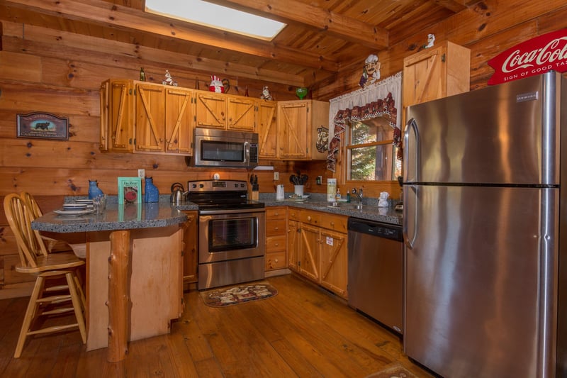 Kitchen with stainless appliances at Hawks Nest, a 1 bedroom cabin rental located in Pigeon Forge