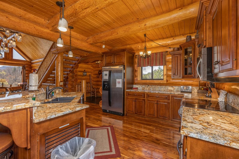 Kitchen with granite counters and stainless appliances at Gods Country, a 4 bedroom cabin rental located in Pigeon Forge