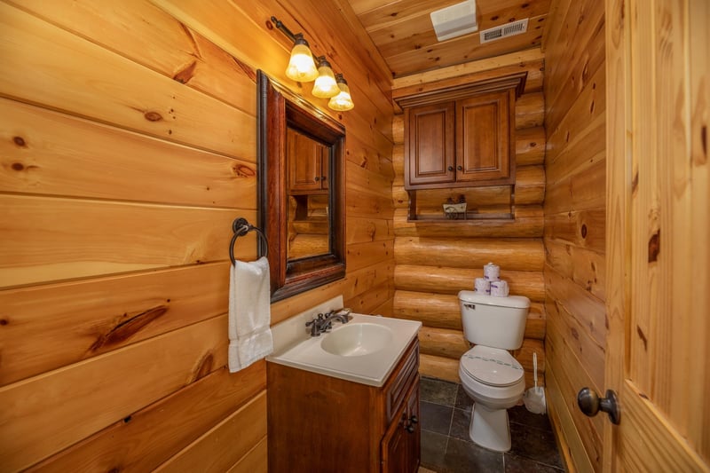 Half bath at Gods Country, a 4 bedroom cabin rental located in Pigeon Forge