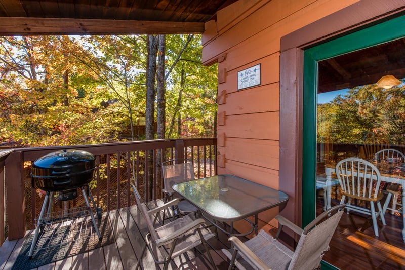 Grill on the covered deck at Hawks Nest, a 1 bedroom cabin rental located in Pigeon Forge