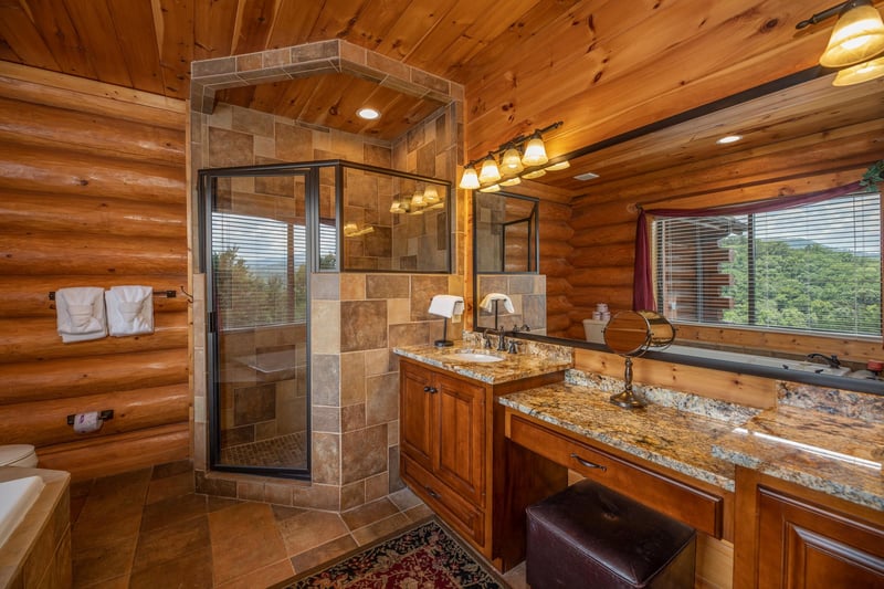 Bathroom with a jacuzzi, separate shower, and double vanity sinks at Gods Country, a 4 bedroom cabin rental located in Pigeon Forge