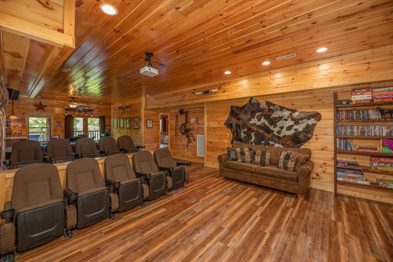 Theater room with sofa and theater seating at Gods Country, a 4 bedroom cabin rental located in Pigeon Forge