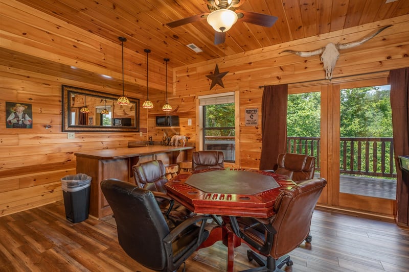 Poker table and bar at Gods Country, a 4 bedroom cabin rental located in Pigeon Forge