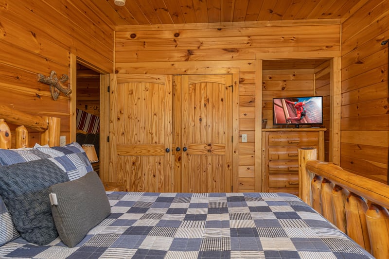 Dresser and TV in a bedroom at Gods Country, a 4 bedroom cabin rental located in Pigeon Forge