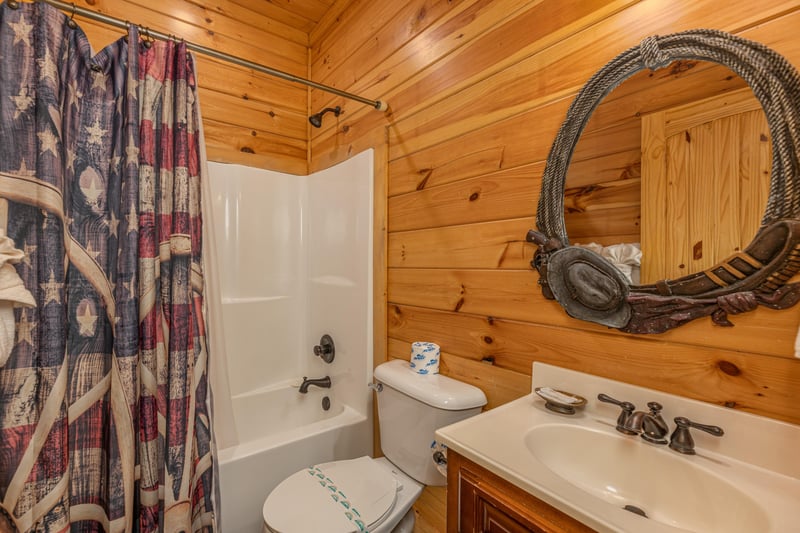 Bathroom with a tub and shower at Gods Country, a 4 bedroom cabin rental located in Pigeon Forge