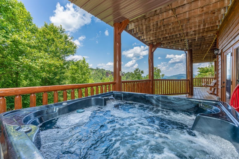 Looking out at the mountains from the hot tub at Gods Country, a 4 bedroom cabin rental located in Pigeon Forge