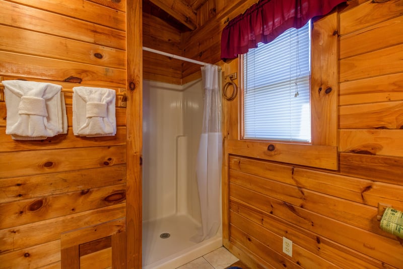 Shower in the upper bathroom at Hawks Nest, a 1 bedroom cabin rental located in Pigeon Forge