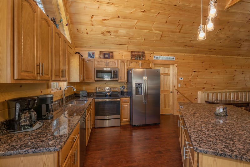 Kitchen with stainless appliances at Gar Bears Hideaway, a 3 bedroom cabin rental located in Pigeon Forge