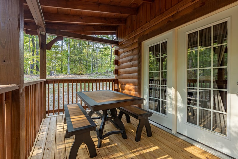 Picnic table on the deck at Gar Bears Hideaway, a Pigeon Forge cabin rental
