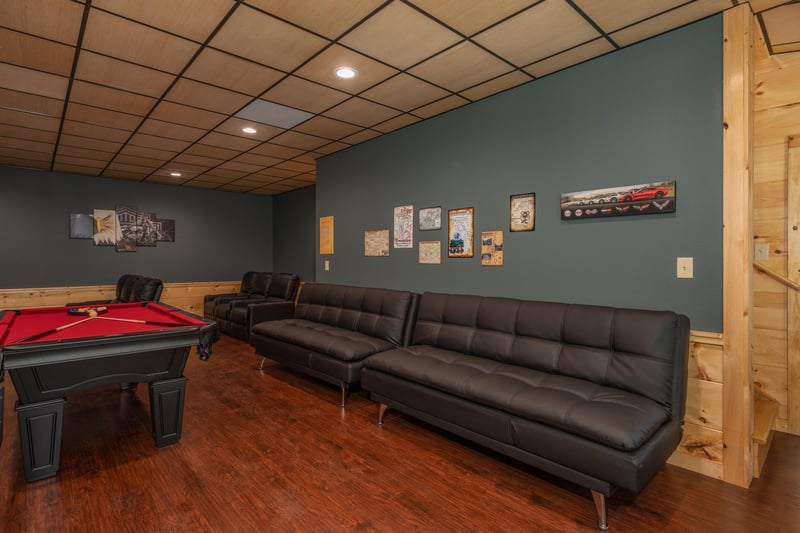 Lots of seating in the game room at Gar Bears Hideaway, a 3 bedroom cabin rental located in Pigeon Forge
