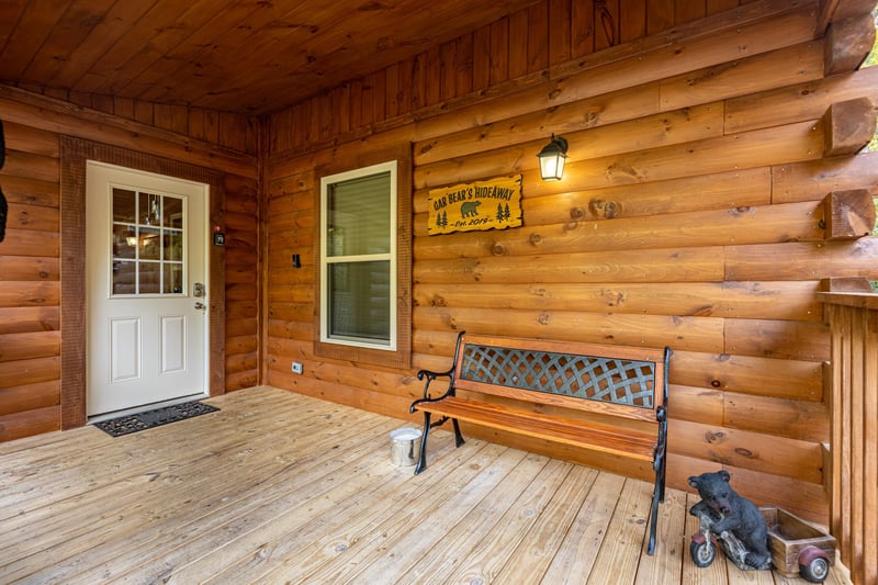 Front porch with bench at Gar Bears Hideaway, a Pigeon Forge cabin rental