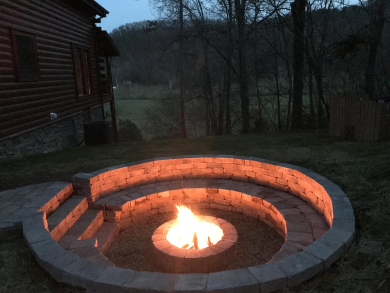 Fire pit at night at Mountain View Meadows, a 3 bedroom cabin rental located in Pigeon Forge