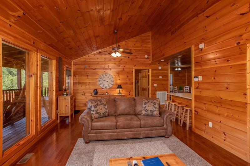 Sofa in the living room at Cabin Fever, a 4bedroom cabin rental located in Pigeon Forge