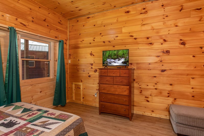 Flat screen TV on a dresser at Cabin Fever, a 4bedroom cabin rental located in Pigeon Forge