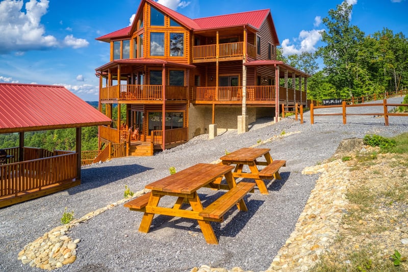 Two picnic tables outside at Four Seasons Palace, a 5bedroom cabin rental located in Pigeon Forge